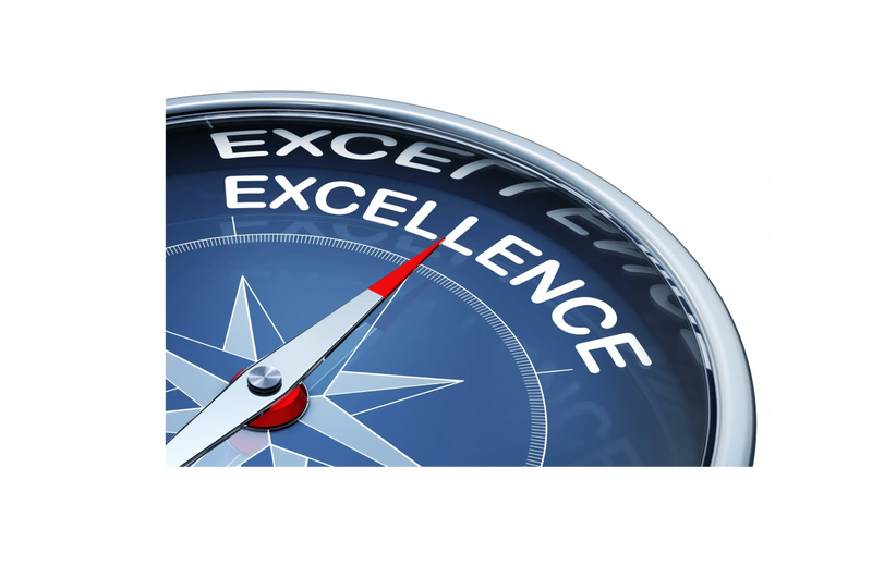 Compass needle pointing to the word Excellence